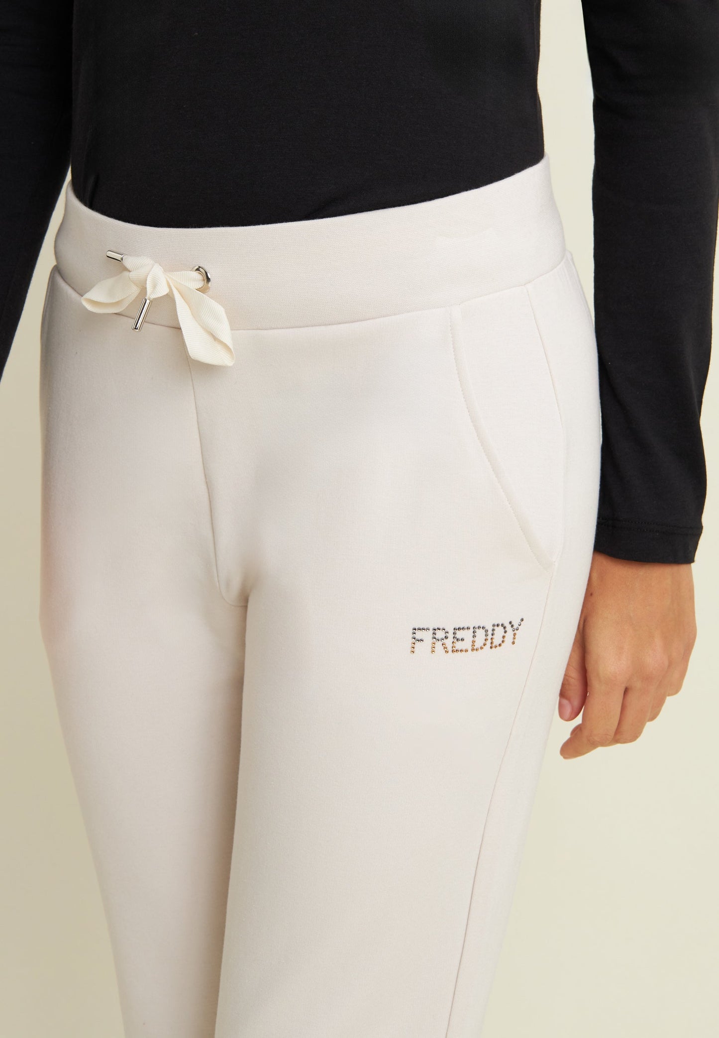 Pantaloni sportivi da donna con polsini e strass bicolore